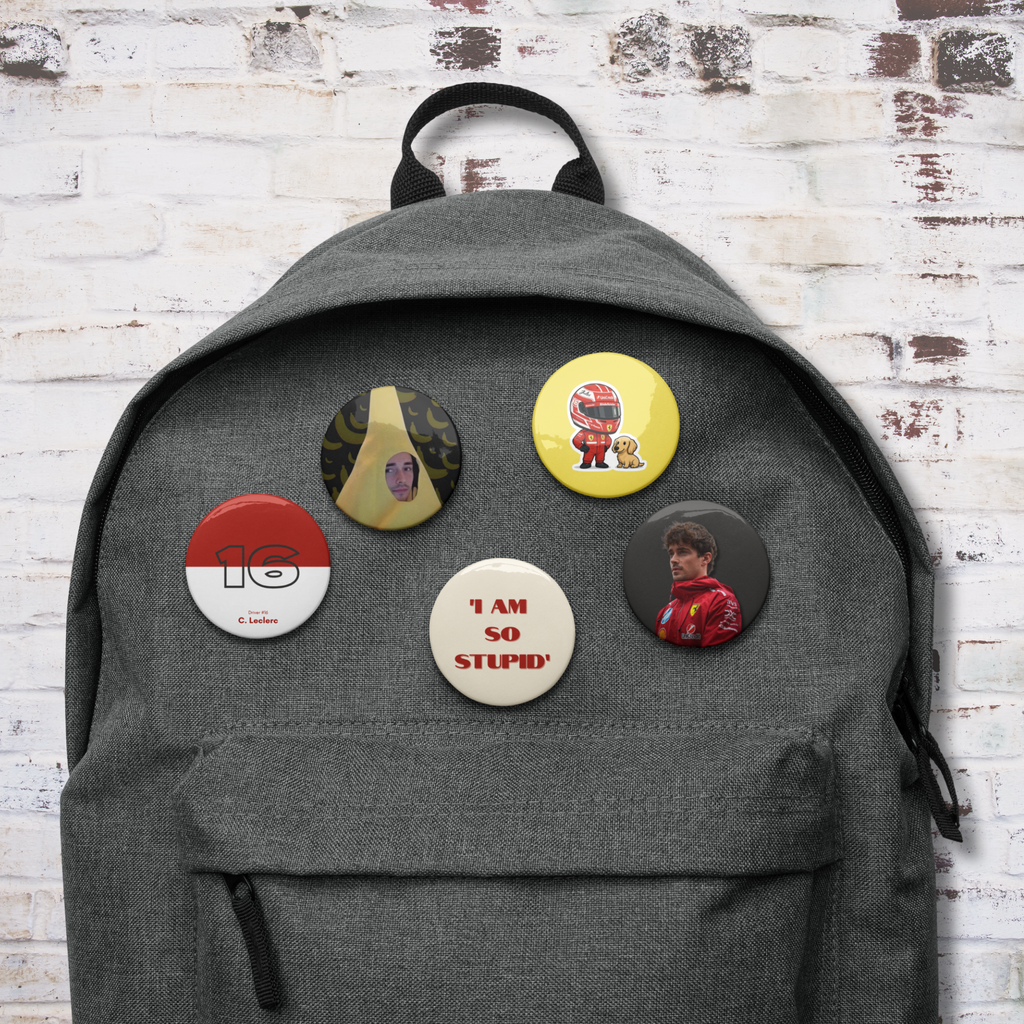 Formula 1 inspired motorsport pin button set with five racing themed designs including driver number and motorsport graphics