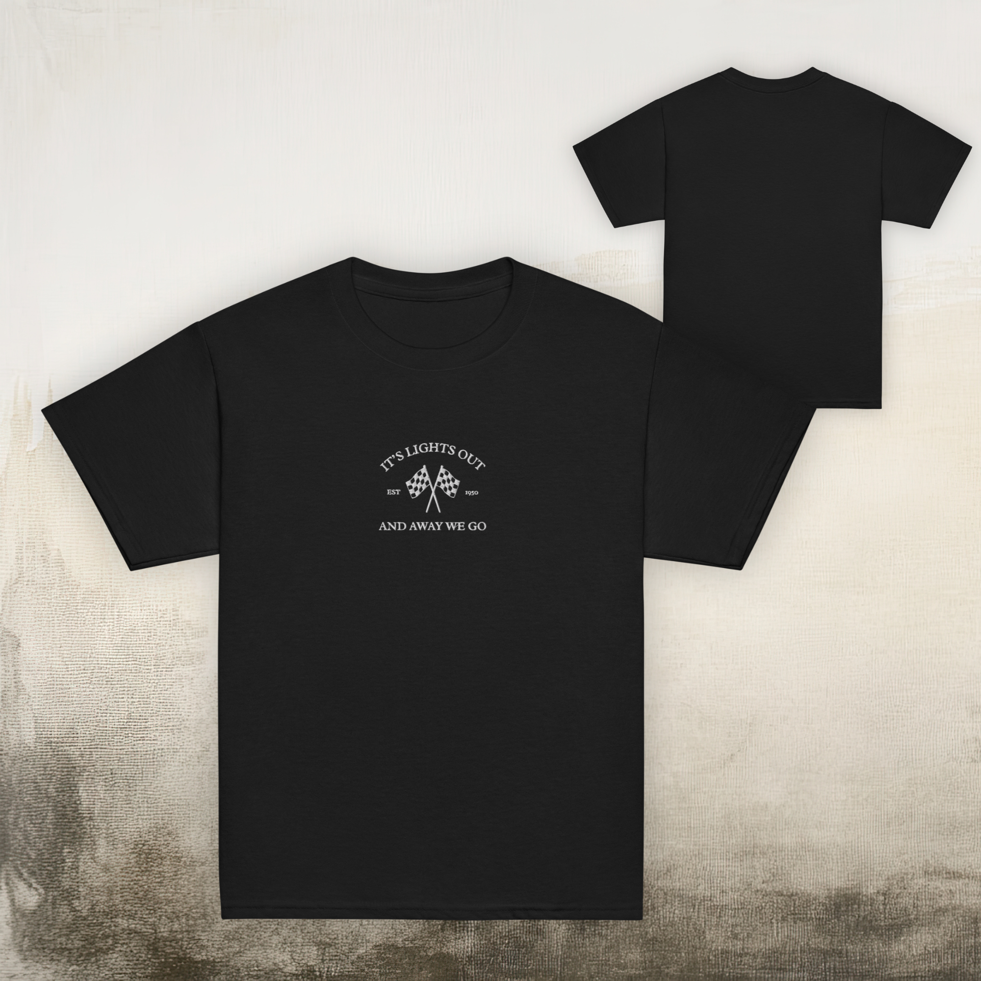 Kids racing t-shirt featuring “It’s Lights Out and Away We Go” with checkered flags. Soft cotton youth motorsport tee for young race fans.