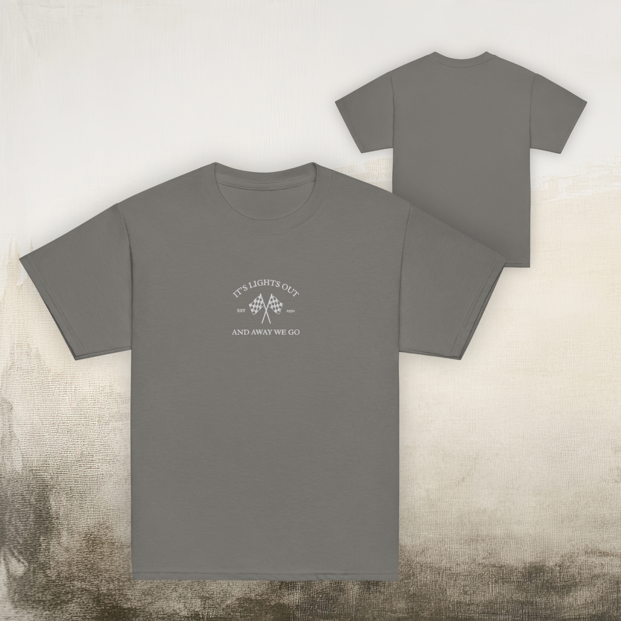 Kids racing t-shirt featuring “It’s Lights Out and Away We Go” with checkered flags. Soft cotton youth motorsport tee for young race fans.