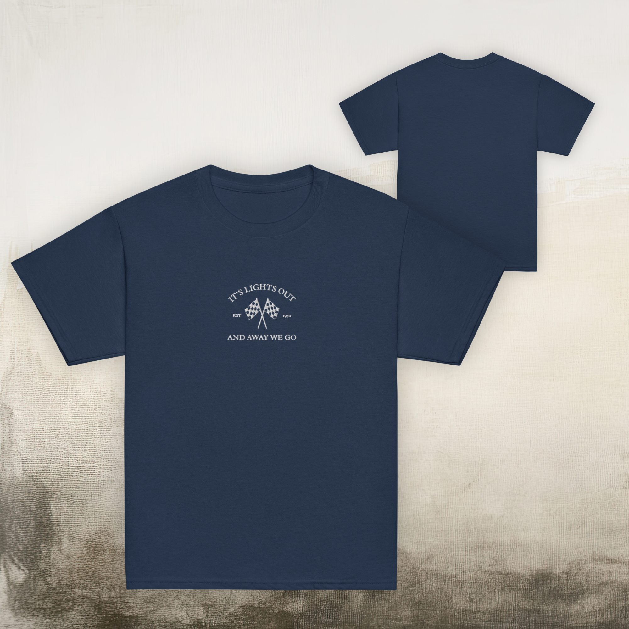 Kids racing t-shirt featuring “It’s Lights Out and Away We Go” with checkered flags. Soft cotton youth motorsport tee for young race fans.