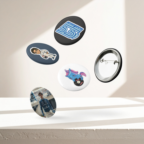 Formula 1 inspired motorsport pin button set with five racing themed designs including racing driver illustration and driver number graphic