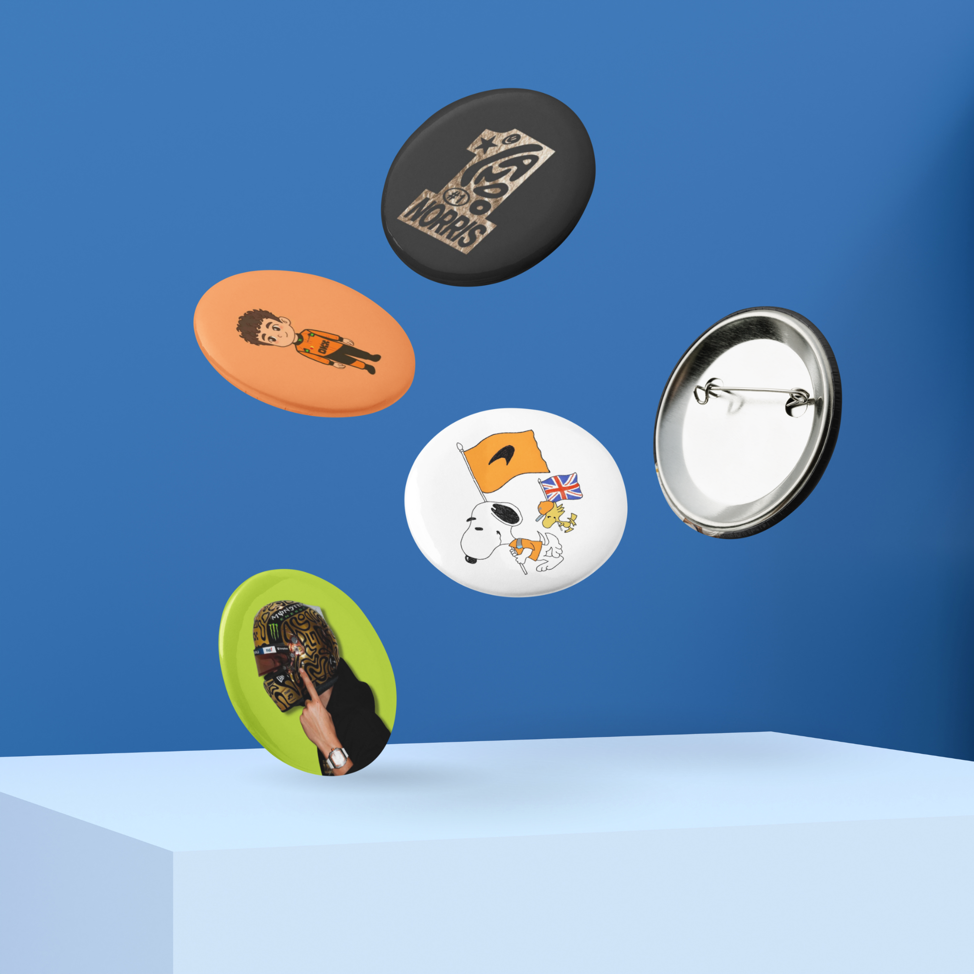 Formula 1 inspired motorsport pin button set with five racing themed designs in orange motorsport style