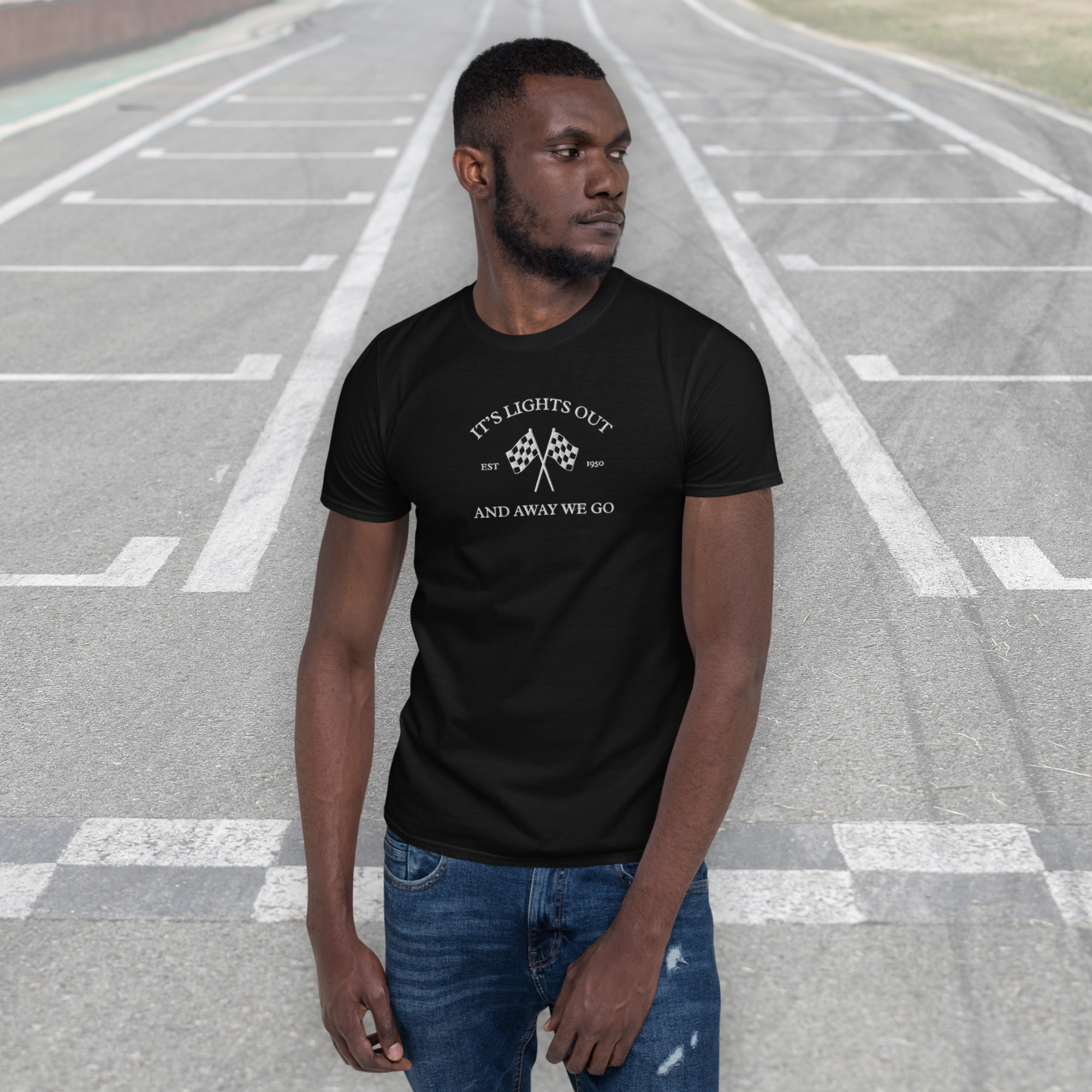 Vintage racing t-shirt featuring “It’s Lights Out and Away We Go” with checkered flags. Soft 100% cotton motorsport graphic tee for true race fans.