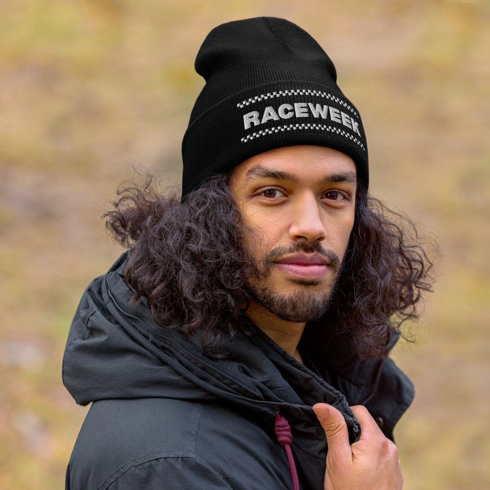 Raceweek motorsport beanie inspired by Formula 1 with checkered flag design worn by model