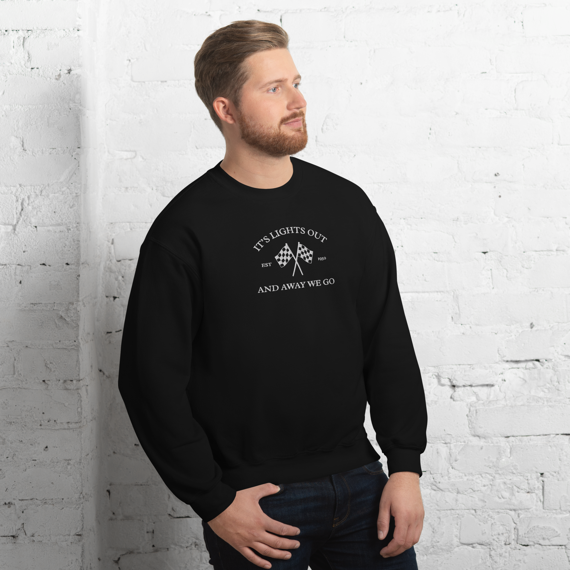 Vintage racing sweatshirt featuring “It’s Lights Out and Away We Go” with checkered flags. Warm motorsport crewneck for race fans and car enthusiasts.